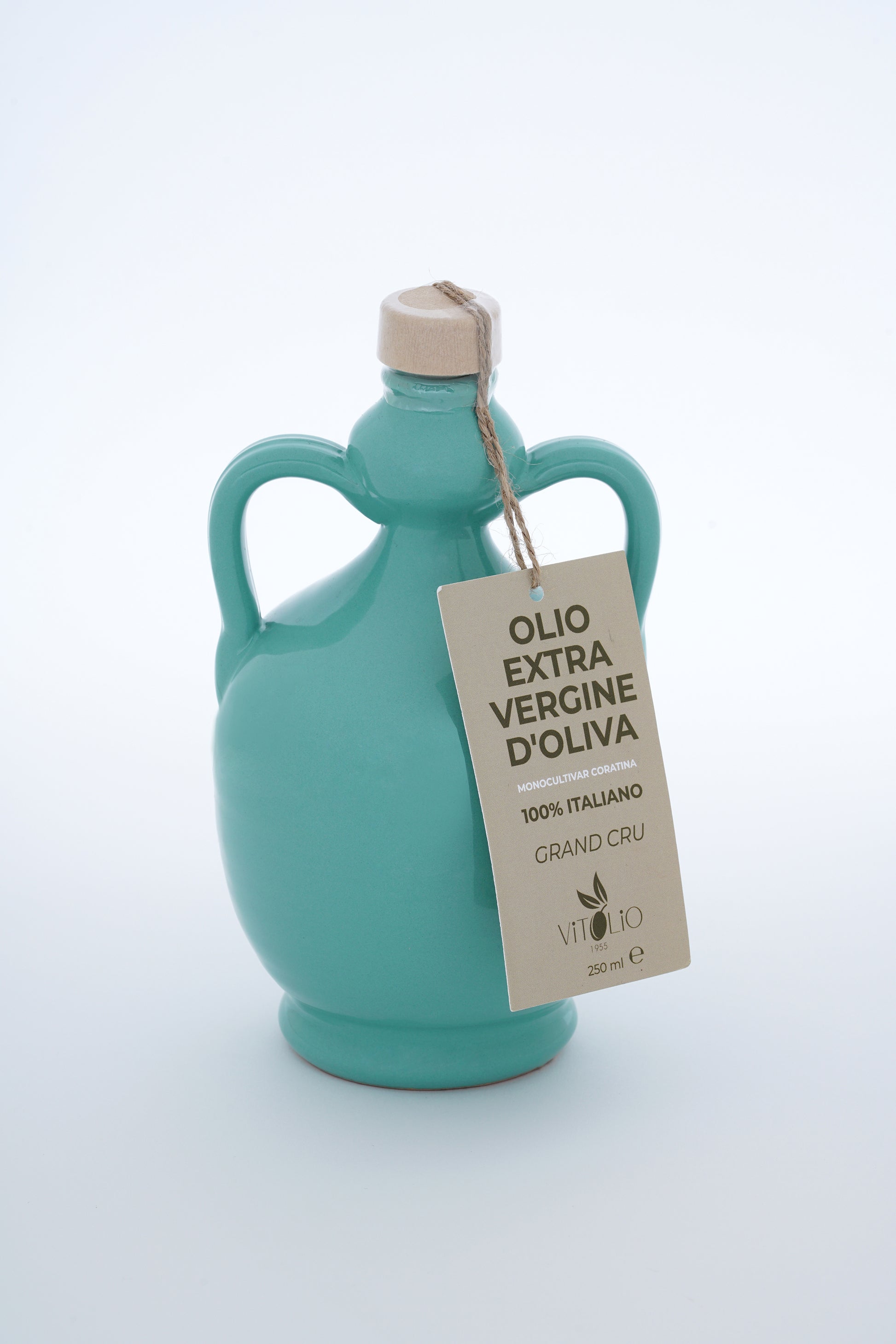 Bottiglia azzurra di Olio Extravergine di Oliva con etichetta bianca e tappo beige